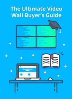 O Ultimate Video Wall Buyer's Guide, vídeo gráfico de parede com tampa de graduação, e uma mesa com laptop e mouse, e livro